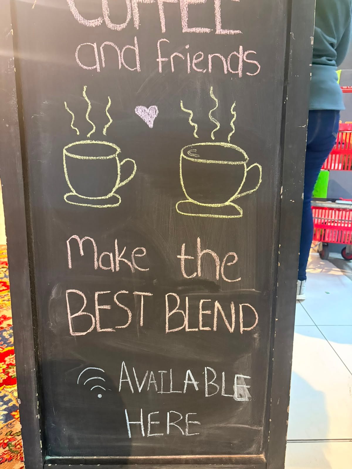 Chalkboard reading: Coffee and friends make the best blend — WiFi available here